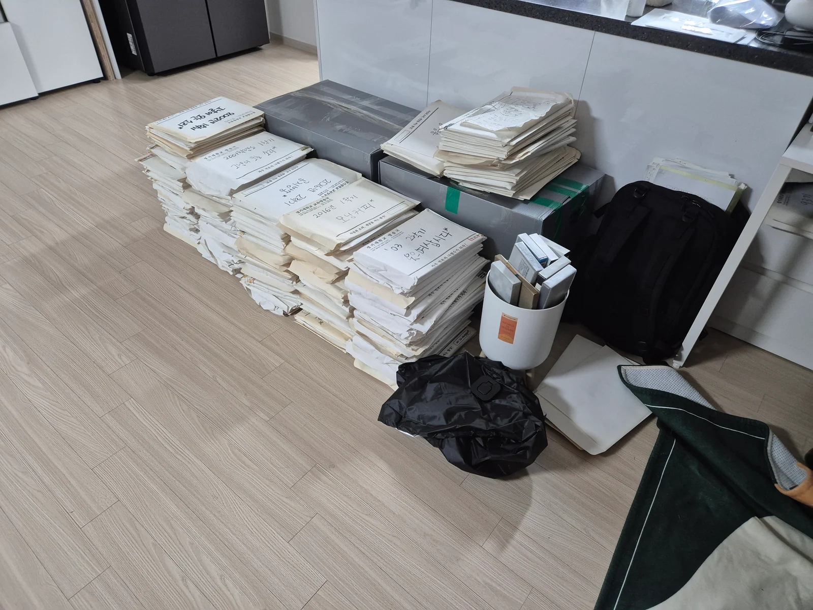 Stacks of original broadcast scripts arranged at a former station member’s home