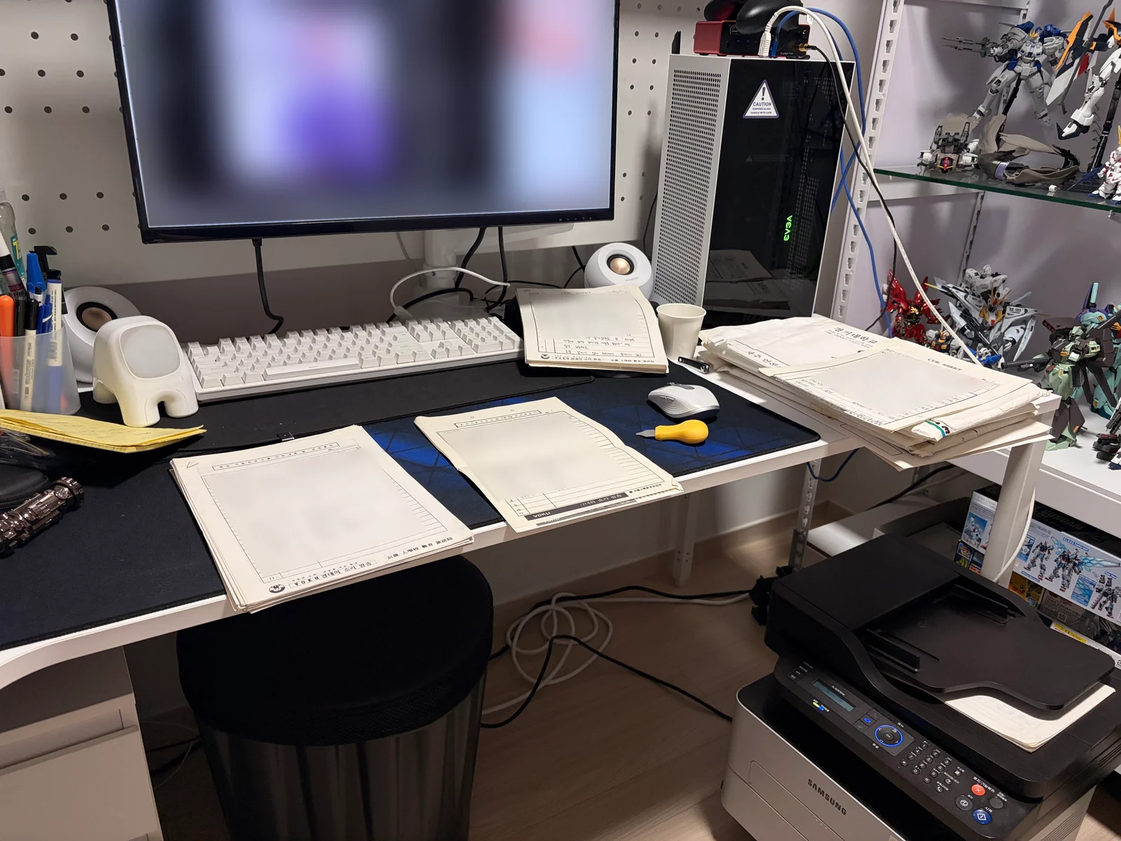 Original pages beside a scanner on a home desk